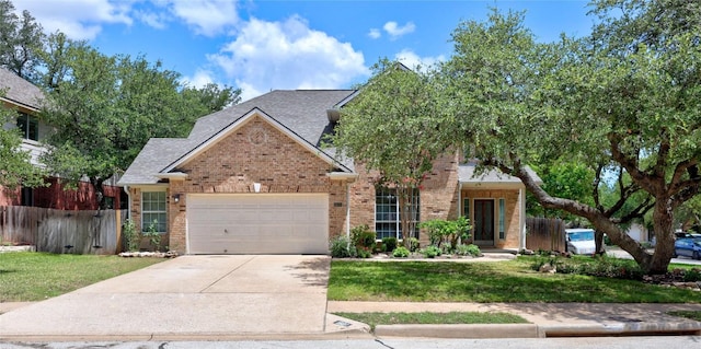 1601 Michael Robert Way, Cedar Park, TX 78613 - view of front facade with brick siding, a garage, concrete driveway, and roof with shingles