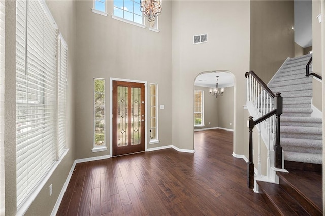 1601 Michael Robert Way, Cedar Park, TX 78613 - foyer entrance with a chandelier, a towering ceiling, hardwood / wood-style floors, and stairway
