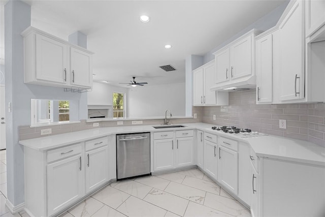 1601 Michael Robert Way, Cedar Park, TX 78613 - kitchen featuring stainless steel dishwasher, white gas stovetop, under cabinet range hood, a ceiling fan, and recessed lighting
