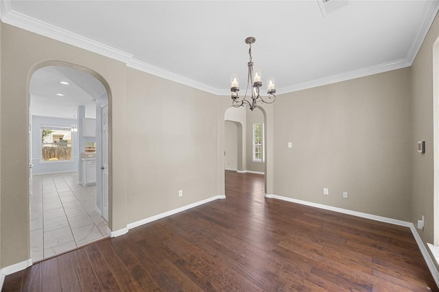 1601 Michael Robert Way, Cedar Park, TX 78613 - empty room featuring arched walkways, hardwood / wood-style floors, ornamental molding, and a chandelier