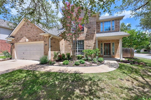1601 Michael Robert Way, Cedar Park, TX 78613 - traditional-style house featuring brick siding, concrete driveway, an attached garage, and a front yard