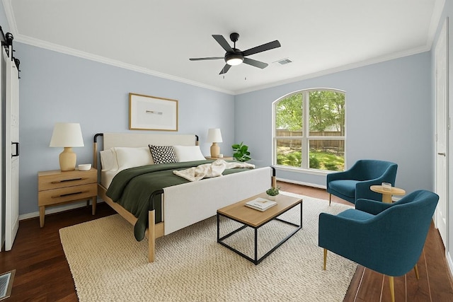1601 Michael Robert Way, Cedar Park, TX 78613 - bedroom featuring ornamental molding, wood finished floors, a barn door, and a ceiling fan