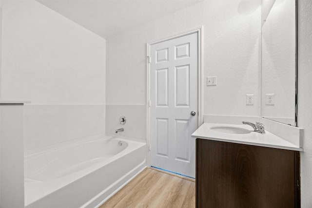 9207 Sandyford Ct, Killeen, TX 76542 - full bath featuring vanity, wood finished floors, and a bath