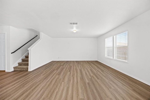 9207 Sandyford Ct, Killeen, TX 76542 - unfurnished living room with wood finished floors and stairway