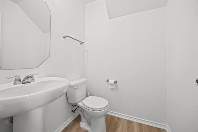 9207 Sandyford Ct, Killeen, TX 76542 - half bath with wood finished floors and a sink
