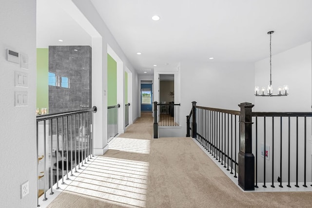 4612 Destination Way, Jonestown, TX 78645 - hallway featuring carpet floors, recessed lighting, a chandelier, and an upstairs landing