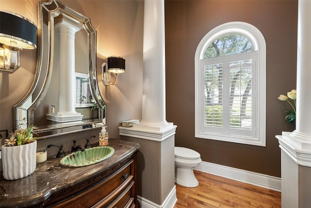 117 Bella Cima Dr, Austin, TX 78734 - bathroom with ornate columns, wood finished floors, and vanity