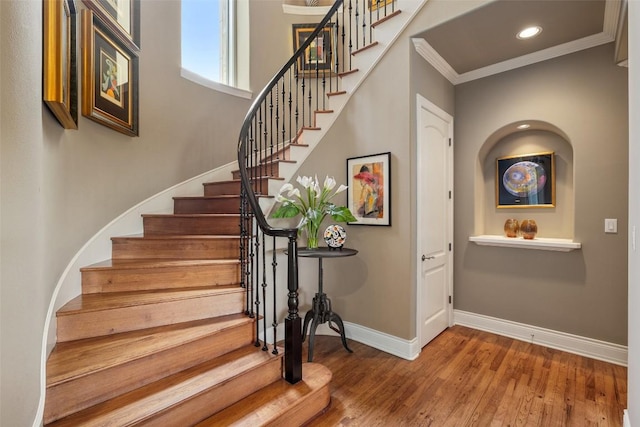 117 Bella Cima Dr, Austin, TX 78734 - stairs featuring wood finished floors, crown molding, and recessed lighting