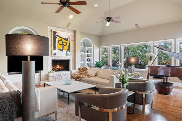 117 Bella Cima Dr, Austin, TX 78734 - living area featuring a ceiling fan, wood finished floors, a fireplace, built in features, and recessed lighting