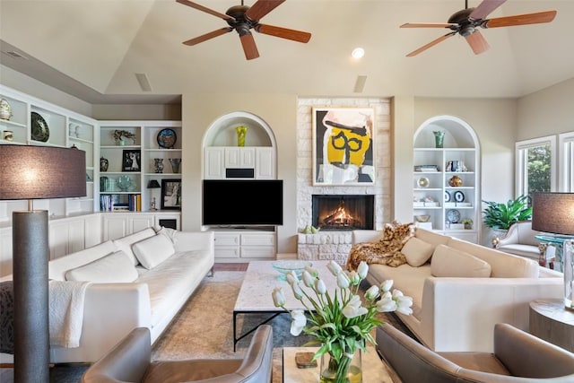 117 Bella Cima Dr, Austin, TX 78734 - living room featuring ceiling fan, vaulted ceiling, a large fireplace, and built in shelves