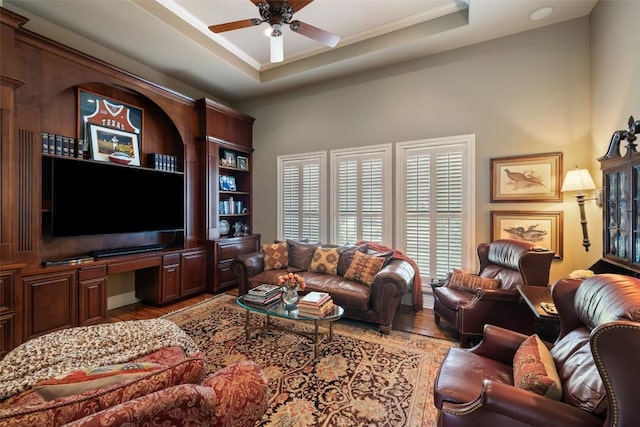 117 Bella Cima Dr, Austin, TX 78734 - living room with light wood-style flooring, ceiling fan, ornamental molding, a raised ceiling, and a high ceiling