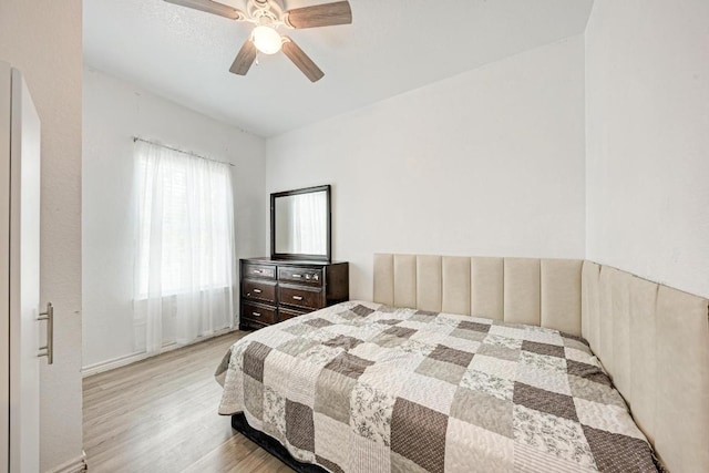 114 Crepe Myrtle Pkwy, Elgin, TX 78621 - bedroom featuring light wood-type flooring, a ceiling fan, and arched walkways