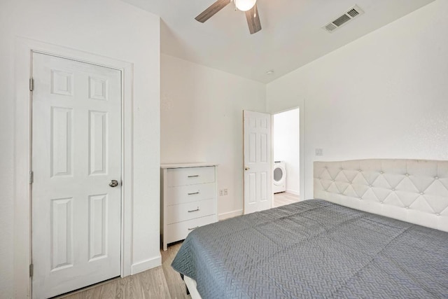 114 Crepe Myrtle Pkwy, Elgin, TX 78621 - bedroom with washer / dryer, light wood-type flooring, and a ceiling fan