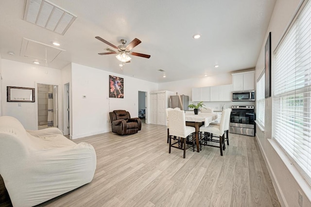 114 Crepe Myrtle Pkwy, Elgin, TX 78621 - dining room with attic access, light wood finished floors, ceiling fan, and recessed lighting