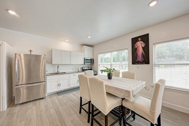 114 Crepe Myrtle Pkwy, Elgin, TX 78621 - dining area with light wood-type flooring and recessed lighting