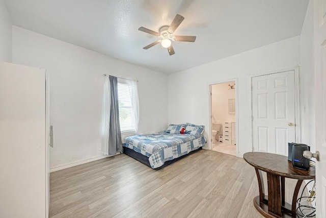 114 Crepe Myrtle Pkwy, Elgin, TX 78621 - bedroom featuring light wood-style floors, ensuite bathroom, and ceiling fan