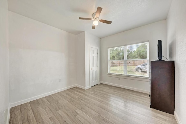 114 Crepe Myrtle Pkwy, Elgin, TX 78621 - empty room with wood finished floors and ceiling fan
