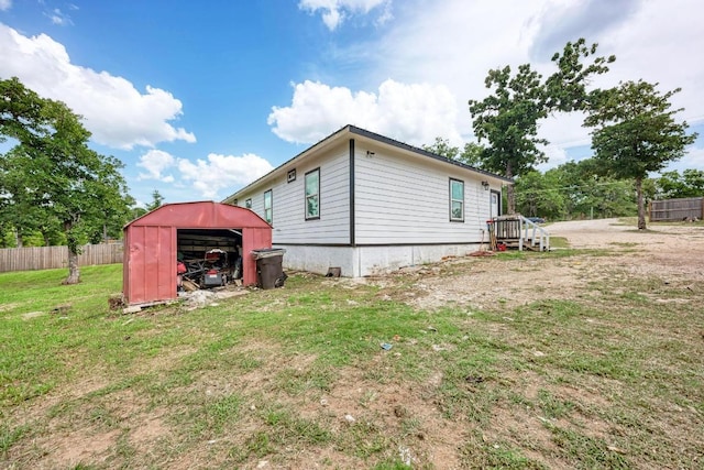 114 Crepe Myrtle Pkwy, Elgin, TX 78621 - rear view of property featuring a storage unit