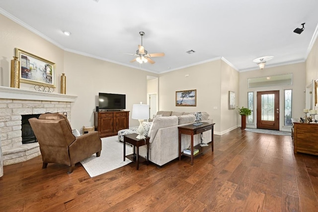 13410 Saddle Back Pass, Austin, TX 78738 - living room featuring dark wood-style flooring, ceiling fan, crown molding, and a fireplace