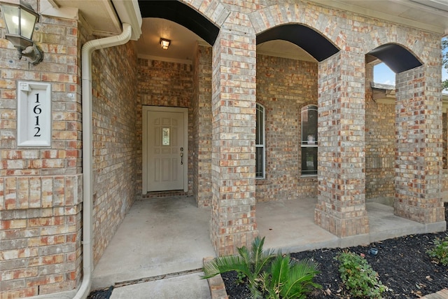 1612 Cora Marie Dr, Pflugerville, TX 78660 - view of exterior entry with brick siding and a porch