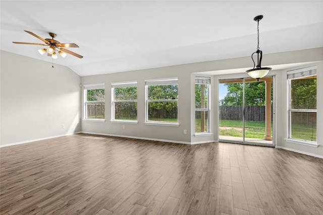 1612 Cora Marie Dr, Pflugerville, TX 78660 - unfurnished living room featuring wood finished floors, ceiling fan, and vaulted ceiling