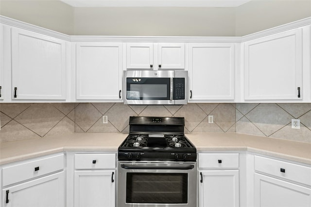 1612 Cora Marie Dr, Pflugerville, TX 78660 - kitchen featuring appliances with stainless steel finishes, white cabinetry, light countertops, and tasteful backsplash