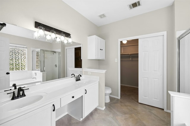 1612 Cora Marie Dr, Pflugerville, TX 78660 - bathroom with a shower stall, a walk in closet, a bath, and double vanity