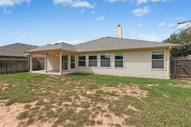 1612 Cora Marie Dr, Pflugerville, TX 78660 - back of property with a patio, a fenced backyard, a chimney, and roof with shingles