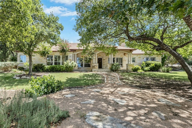 1403 Roaring Frk, Leander, TX 78641 - view of front facade featuring stone siding and a front yard