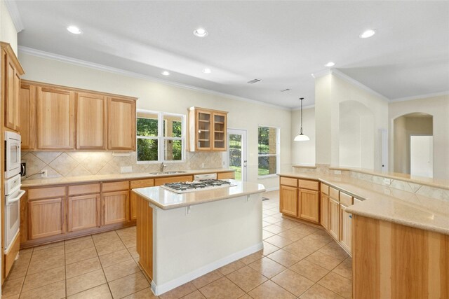 1403 Roaring Frk, Leander, TX 78641 - kitchen with white appliances, light tile patterned flooring, recessed lighting, tasteful backsplash, and ornamental molding