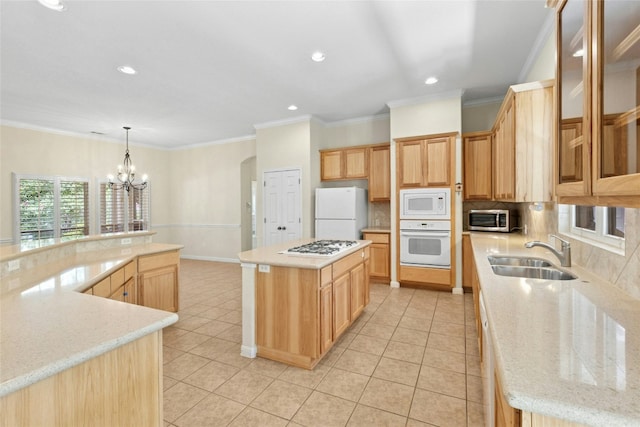 1403 Roaring Frk, Leander, TX 78641 - kitchen with white appliances, a large island, decorative backsplash, a chandelier, and recessed lighting