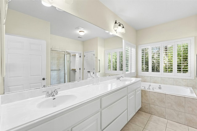 1403 Roaring Frk, Leander, TX 78641 - full bathroom featuring double vanity, a shower stall, tile patterned floors, and a garden tub