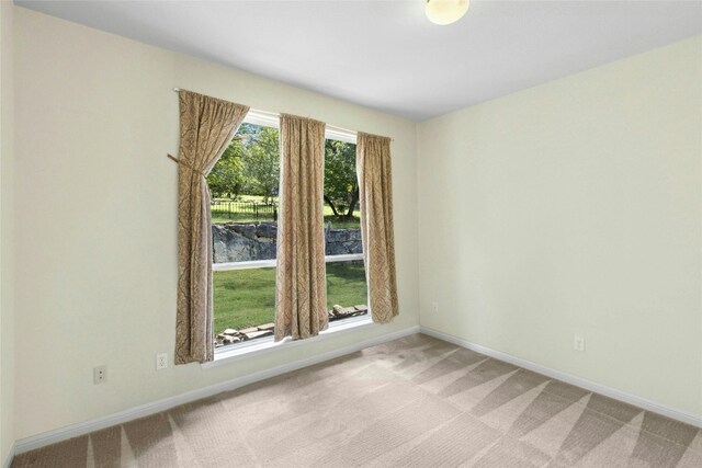 1403 Roaring Frk, Leander, TX 78641 - spare room featuring light carpet and baseboards