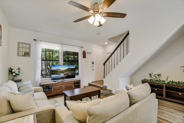 11901 Swearingen Dr Unit 4, Austin, TX 78758 - living area featuring light wood finished floors, a ceiling fan, stairway, and recessed lighting