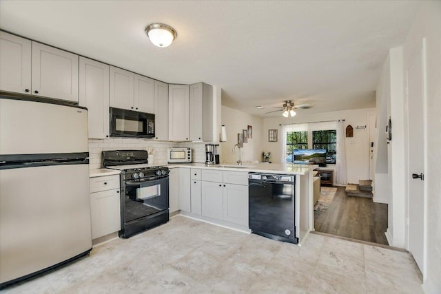 11901 Swearingen Dr Unit 4, Austin, TX 78758 - kitchen featuring black appliances, a peninsula, light countertops, tasteful backsplash, and ceiling fan