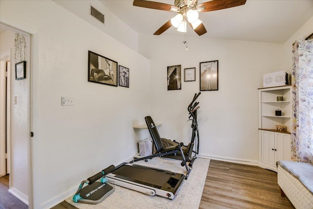 11901 Swearingen Dr Unit 4, Austin, TX 78758 - exercise room featuring ceiling fan, wood finished floors, and vaulted ceiling