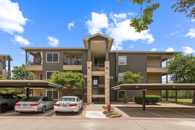 2320 Gracy Farms Ln Unit 522, Austin, TX 78758 - view of building exterior featuring covered parking