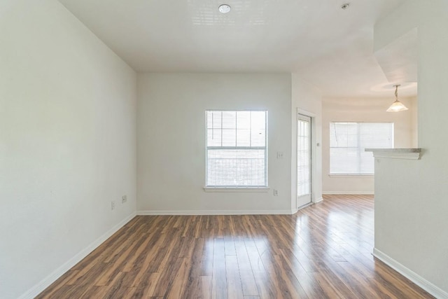 2320 Gracy Farms Ln Unit 522, Austin, TX 78758 - spare room with wood finished floors and baseboards