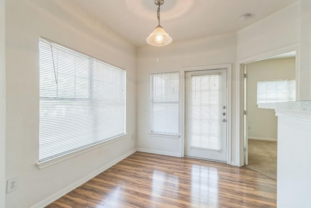 2320 Gracy Farms Ln Unit 522, Austin, TX 78758 - spare room with wood finished floors, healthy amount of natural light, and a smoke detector