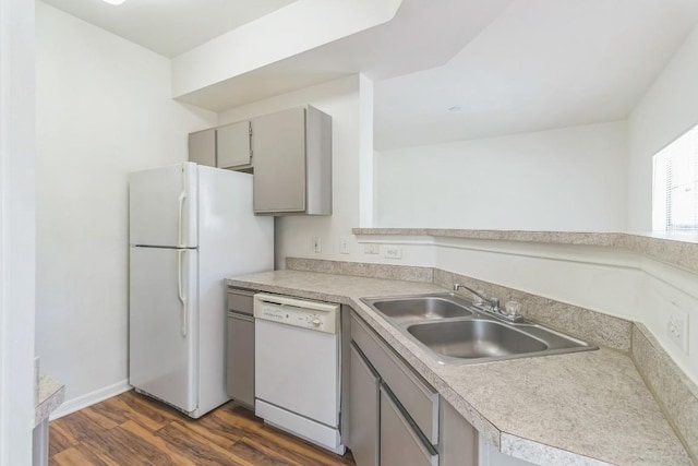 2320 Gracy Farms Ln Unit 522, Austin, TX 78758 - kitchen featuring white appliances, gray cabinetry, dark wood-style floors, and light countertops