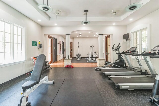 2320 Gracy Farms Ln Unit 522, Austin, TX 78758 - gym featuring ornate columns, a raised ceiling, and recessed lighting