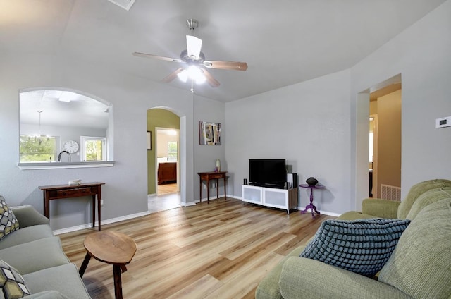 106 Wild Plum, San Marcos, TX 78666 - living room featuring arched walkways, wood finished floors, and ceiling fan