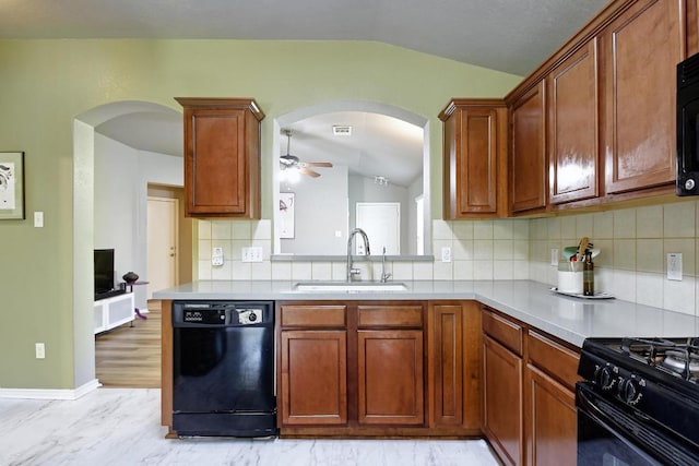 106 Wild Plum, San Marcos, TX 78666 - kitchen featuring black appliances, vaulted ceiling, arched walkways, a ceiling fan, and light countertops