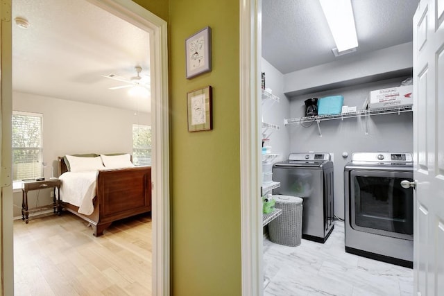 106 Wild Plum, San Marcos, TX 78666 - laundry room with separate washer and dryer, ceiling fan, and plenty of natural light