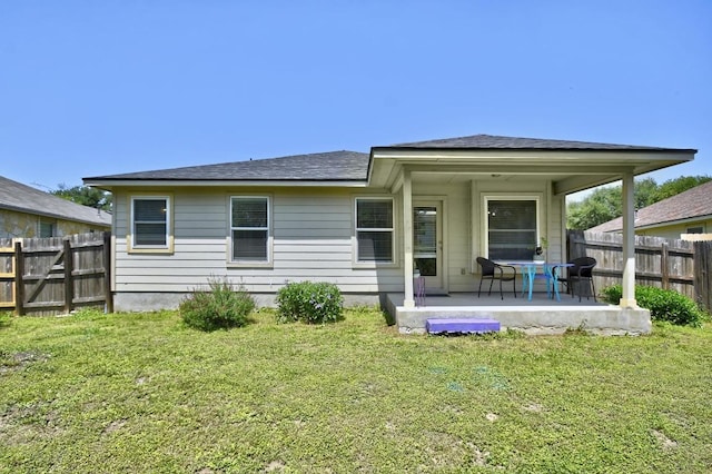 106 Wild Plum, San Marcos, TX 78666 - back of house with a patio area, a fenced backyard, and roof with shingles