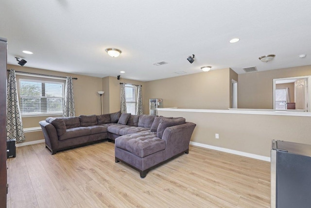 1124 Calla Lily Blvd, Leander, TX 78641 - living room with light wood-style flooring and recessed lighting