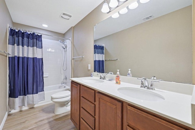1124 Calla Lily Blvd, Leander, TX 78641 - bathroom with wood finished floors, shower / bath combo, and double vanity
