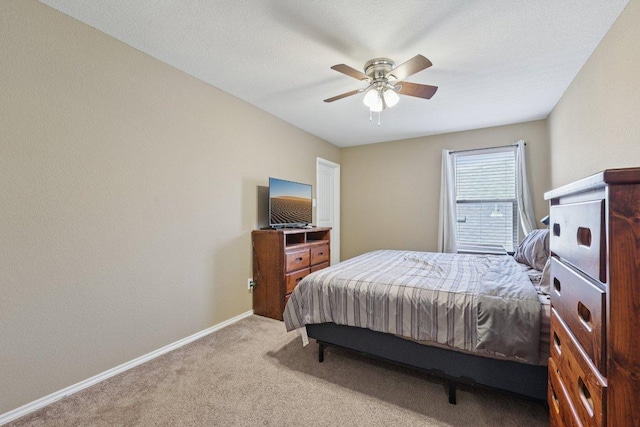1124 Calla Lily Blvd, Leander, TX 78641 - carpeted bedroom with baseboards and ceiling fan