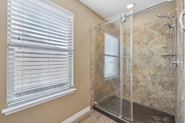 1124 Calla Lily Blvd, Leander, TX 78641 - bathroom featuring a stall shower and wood finished floors