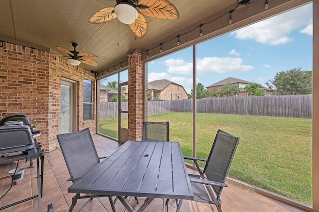 1124 Calla Lily Blvd, Leander, TX 78641 - fenced backyard with ceiling fan, outdoor dining area, a patio, and area for grilling